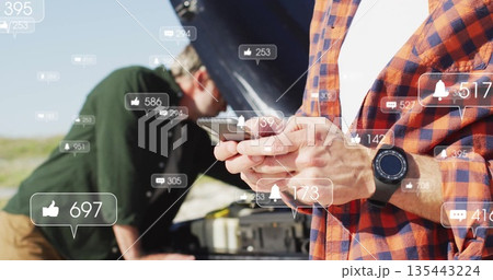 Checking smartphone man in plaid shirt at roadside, with open-hood car and social icons, copy space Checking smartphone man in plaid shirt at roadside, with open-hood car and social icons, copy space 135443224