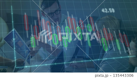 Team in business attire examining charts and laptop in meeting room, with digital overlay Team in business attire examining charts and laptop in meeting room, with digital overlay 135443306