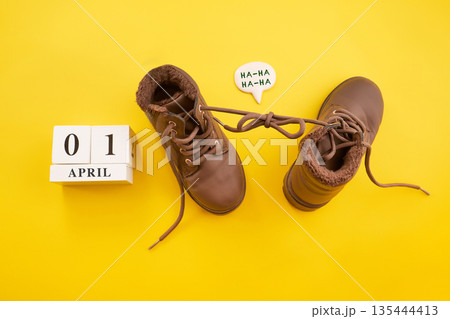 Tied shoelaces april fools' day prank concept 135444413