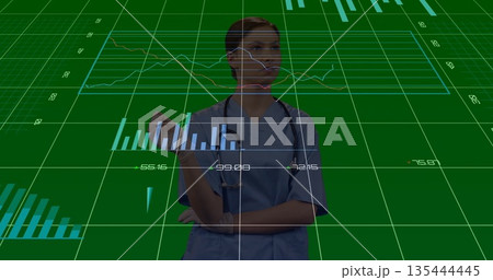 Analyzing teenage nurse in blue scrubs and stethoscope studying green grid interface with charts 135444445