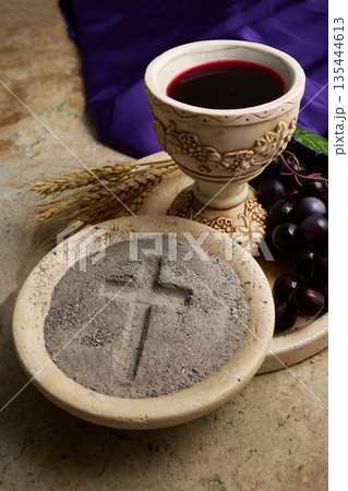 Ash wednesday symbolism with communion chalice and grapes Ash wednesday symbolism with communion chalice and grapes 135444613