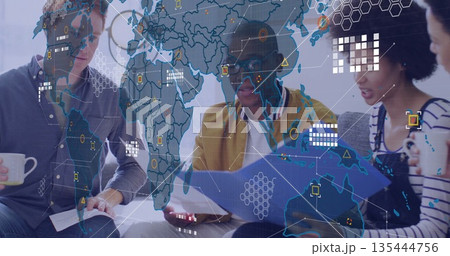 Discussing team of colleagues reviewing reports in office lounge, with mugs, binder, data overlay Discussing team of colleagues reviewing reports in office lounge, with mugs, binder, data overlay 135444756