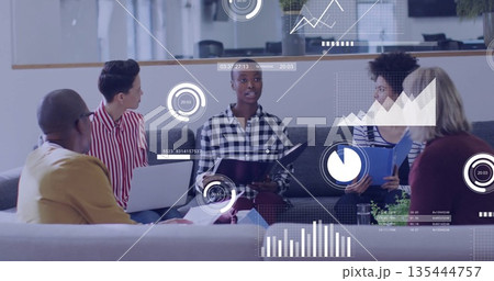 Analyzing data visuals with African American woman holding folder on sofa in lounge, with laptop Analyzing data visuals with African American woman holding folder on sofa in lounge, with laptop 135444757