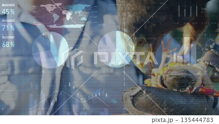 Displaying falconer holding falcon on leather glove in presentation studio, with holographic data Displaying falconer holding falcon on leather glove in presentation studio, with holographic data 135444783