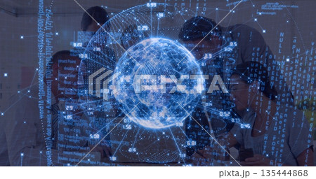 Collaborating professionals analyzing holographic globe in modern office meeting room, with tablet 135444868