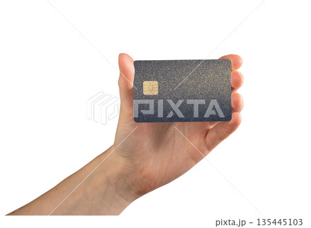 Bank card in hand buy close up. Plastic chip for payment, shopping and commerce service. Finance 135445103