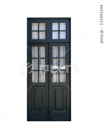 Old wooden door with glass windows and curtains, traditional architecture detail. Vintage entrance 135445244