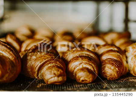 Baking croissant cookies. 135445290