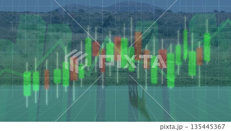 Standing adult elephant raising trunk at riverside channel with green red candlestick bars and grid 135445367