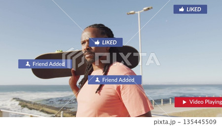 Standing man wearing pink T-shirt holding skateboard on sea walkway, with rails, lamp post, icons Standing man wearing pink T-shirt holding skateboard on sea walkway, with rails, lamp post, icons 135445509