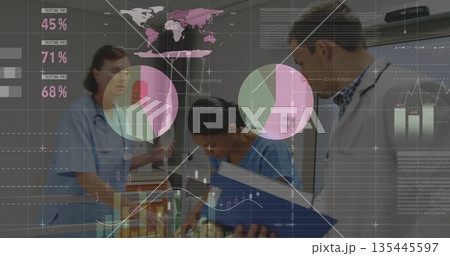 Examining hospital team reviewing patient charts on exam table, stethoscopes and digital overlays 135445597