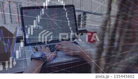 Analyzing stock market charts man wearing smartwatch working on laptop on balcony, with coffee cup 135445602