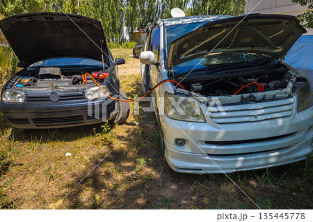 Jump starting cars Jump starting cars 135445778