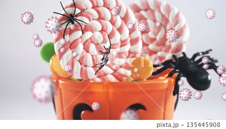 Image of halloween candy and spiders with multiple cells floating on white background Image of halloween candy and spiders with multiple cells floating on white background 135445908