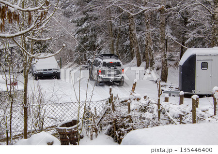 Car driving off the mountain through the snow 135446400