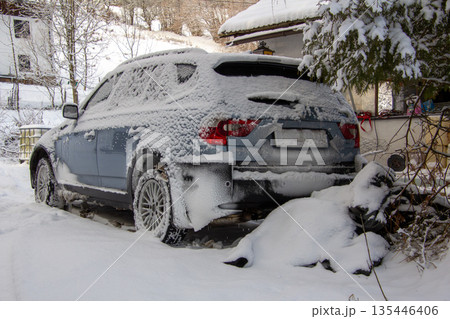 Four-wheel drive car covered with snow and ice 135446406