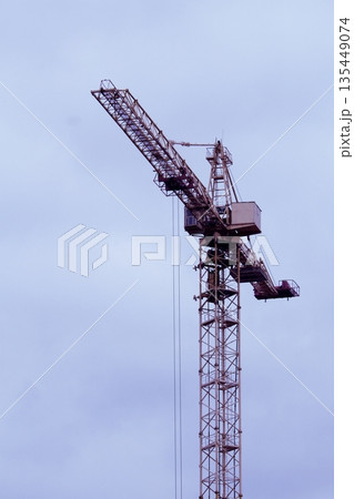 Construction High Altitude Tower Crane Isolated Over Blue Sky Background  135449074