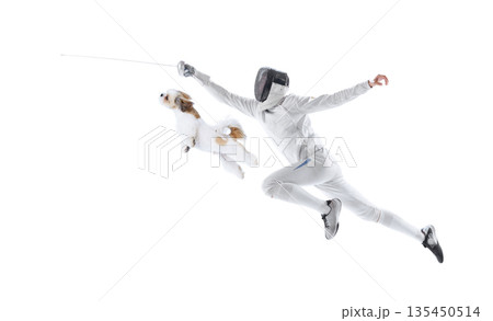 Fencer lunging with sword alongside jumping dog composition. 135450514