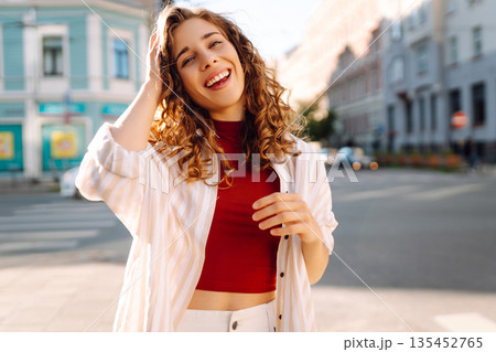 Happy woman tourist with phone. Young woman writing text for sharing content about vacations Happy woman tourist with phone. Young woman writing text for sharing content about vacations 135452765
