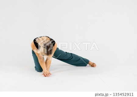 Dancer performing modern dance on white background 135452911