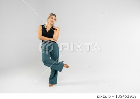 Businesswoman showing something with hand on white background Businesswoman showing something with hand on white background 135452918