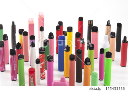 Set of colorful disposable electronic cigarettes of different shapes on a white background. The concept of modern smoking. 135453586
