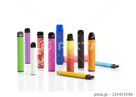 Set of colorful disposable electronic cigarettes of different shapes on a white background. The concept of modern smoking. 135453599