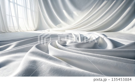 Elegant white velvet fabric with soft flowing folds illuminated by gentle light 135453884