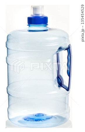 Large clear plastic water cooler bottle with a blue handle and cap. Gallon jug for office or home hydration. Large clear plastic water cooler bottle with a blue handle and cap. Gallon jug for office or home hydration. 135454529