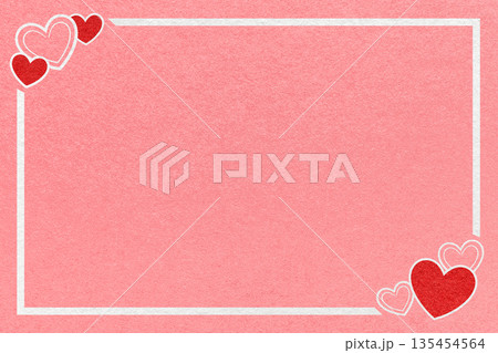 Valentines Day pink romantic background from textured paper with red hearts, white frame and copy space for banner 135454564