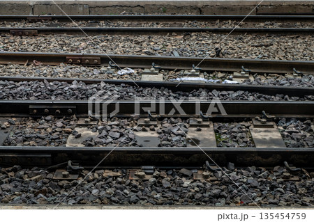 Railroad crossing through in railway station. Railroad crossing through in railway station. 135454759