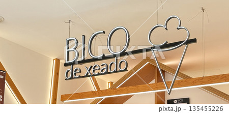 Bright Neon Sign Illuminating a Dessert Shop Called BICO de Xeado Bright Neon Sign Illuminating a Dessert Shop Called BICO de Xeado 135455226