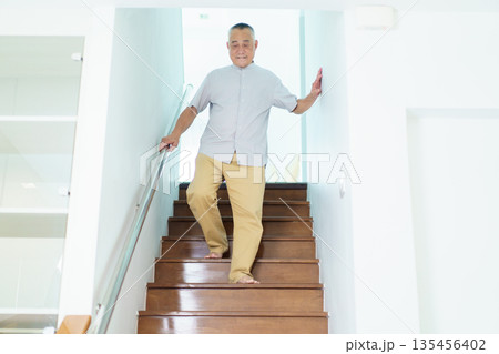 Asian elderly man got an accident. 135456402