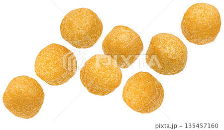 Falling crispy corn balls, crunchy texture with salted coating isolated on white background, full depth of field 135457160