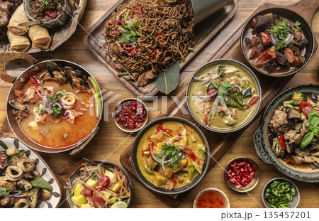 many different thai food dishes on table in modern restaurant in bangkok thailand many different thai food dishes on table in modern restaurant in bangkok thailand 135457201
