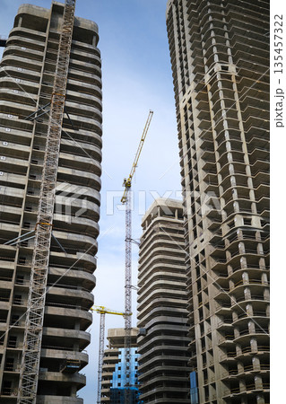 Tall modern building being built from concrete. High quality photo Tall modern building being built from concrete. High quality photo 135457322