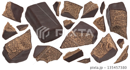 Chocolate candies broken into pieces, dark chocolate coating, crumbly filling texture, isolated on white background, full depth of field Chocolate candies broken into pieces, dark chocolate coating, crumbly filling texture, isolated on white background, full depth of field 135457380