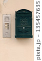Italian Mailbox and Intercom on Stucco Wall 135457635