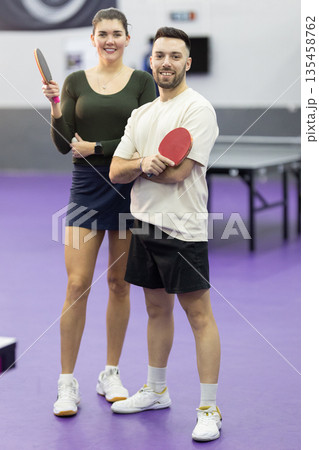 Young couple enjoying table tennis sport activity together 135458762