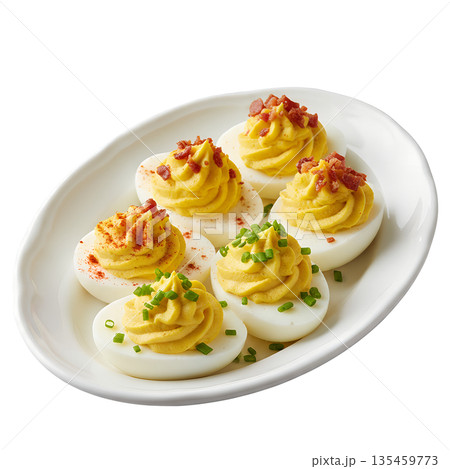 Classic deviled egg halves, perfectly filled and sprinkled with paprika, arranged on simple white plate, party appetizer 135459773