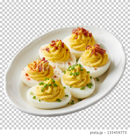 Classic deviled egg halves, perfectly filled and sprinkled with paprika, arranged on simple white plate, party appetizer 135459773