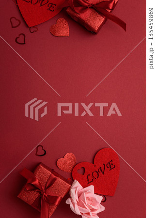 Festive Red Gift Boxes with Roses and Heart Confetti onFestive Background for Valentine's Day Celebration Festive Red Gift Boxes with Roses and Heart Confetti onFestive Background for Valentine's Day Celebration 135459869
