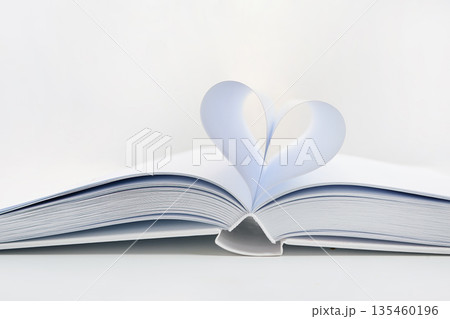 Open book showing heart shape with paper pages 135460196