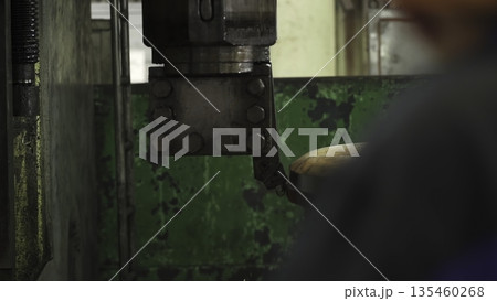 Industrial robotic arm stamping metal in factory. Stock clip Industrial robotic arm stamping metal in factory. Stock clip 135460268