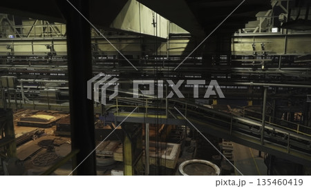 Industrial conveyor belt transporting materials in steel mill. Stock clip Industrial conveyor belt transporting materials in steel mill. Stock clip 135460419