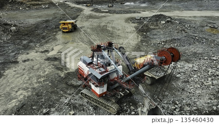 Mining operations extracting minerals in a quarry. Stock clip Mining operations extracting minerals in a quarry. Stock clip 135460430