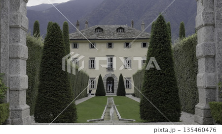 An Elegant Villa Surrounded by Beautifully Manicured Gardens and Majestic Mountains. Action An Elegant Villa Surrounded by Beautifully Manicured Gardens and Majestic Mountains. Action 135460476