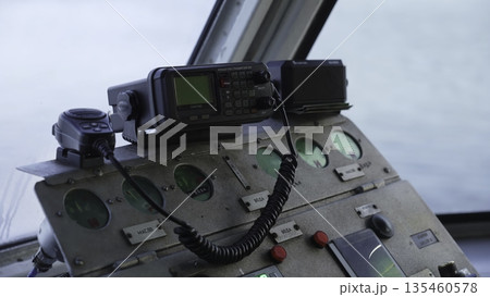 Captain using ship radio controls on bridge. Clip Captain using ship radio controls on bridge. Clip 135460578