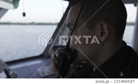 Sailor communicating with walkie talkie on a ship. Clip Sailor communicating with walkie talkie on a ship. Clip 135460587