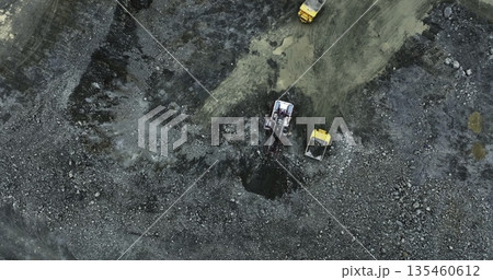 Mining truck unloading gravel into a pit at a quarry. Stock clip 135460612